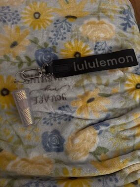 lululemon black key fob with iridescent lip balm holder